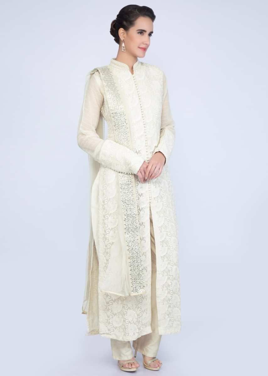 Light Cream Thread Embroidered Chiffon Suit With Raw Silk Pant And Net Dupatta Online - Kalki Fashion