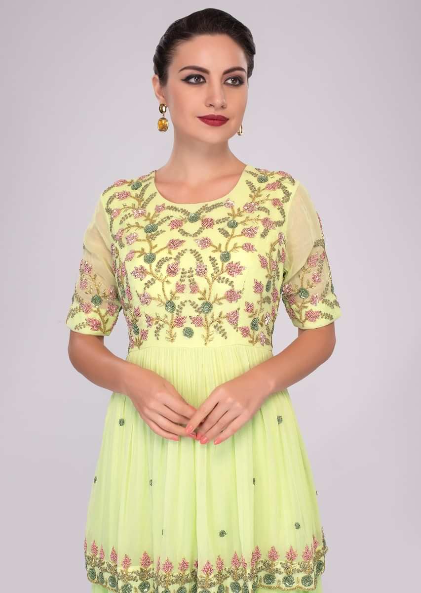 Light green fancy georgette anarkali in layers and peplum style embroidered bodice 