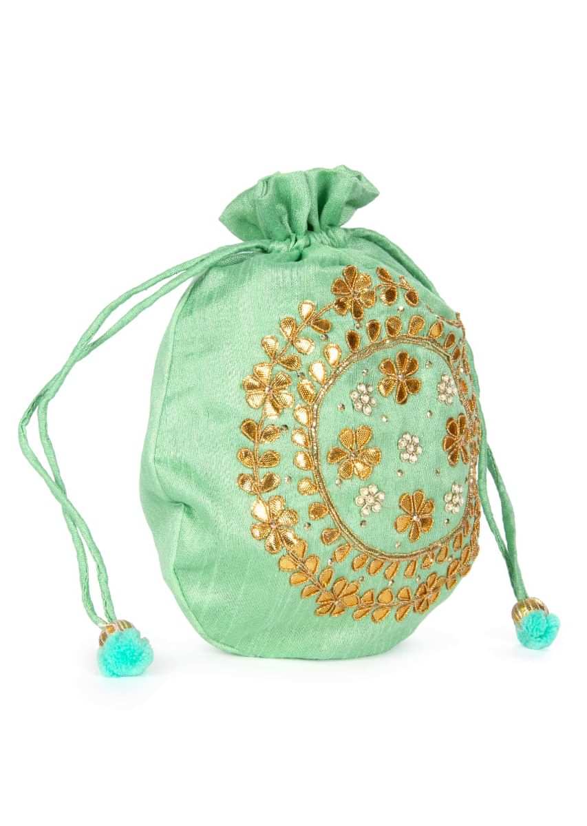 Light green velvet potli bag embellished in gotta patch and moti kalki