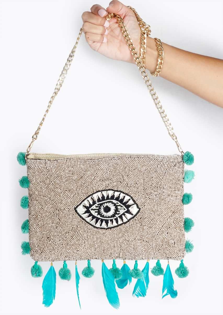 Light Grey Sling Bag With Thread Embroidered Evil Eye, Pompoms And Feathers By Sole House