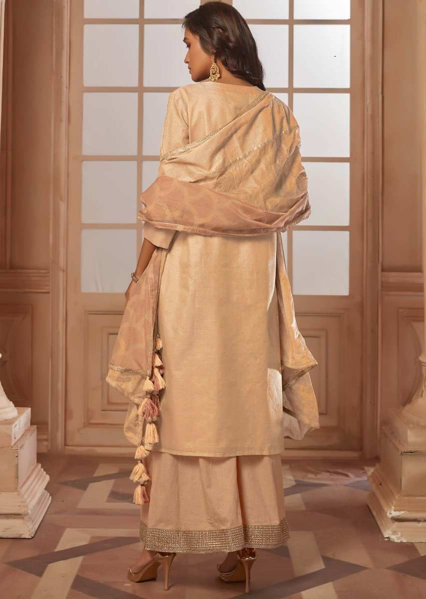 Light peach straight palazzo suit with embroidered butti and fancy buttons