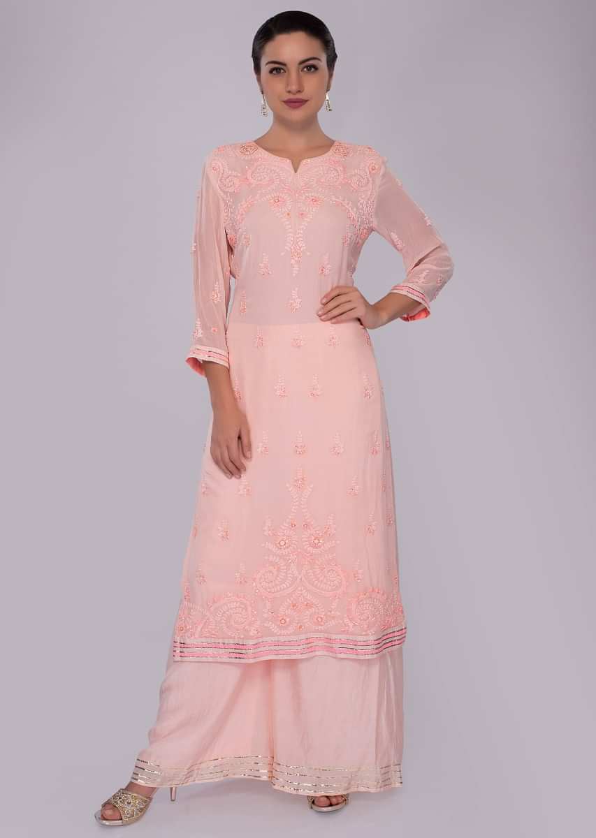 Light peach suit set in self thread embroidered butti and border 