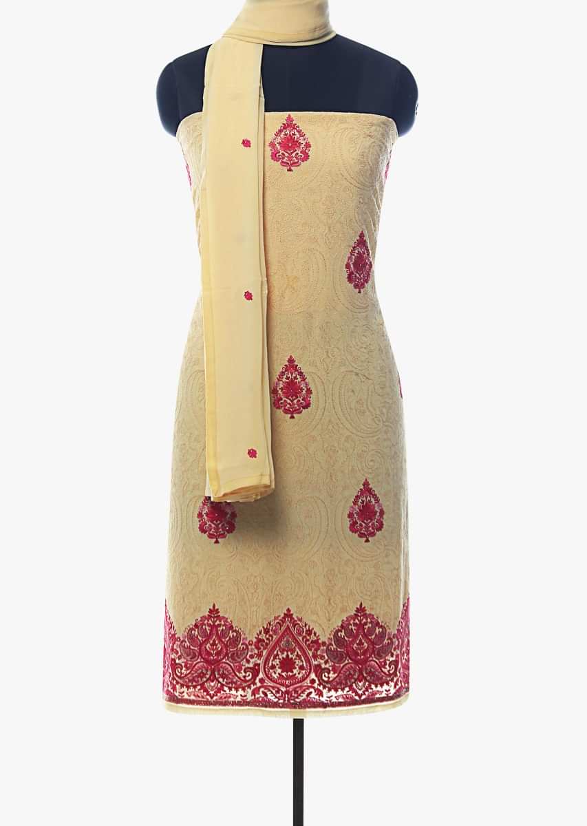 Light yellow unstitched suit adorn in paisley motif embroidered butti and border only on Kalki