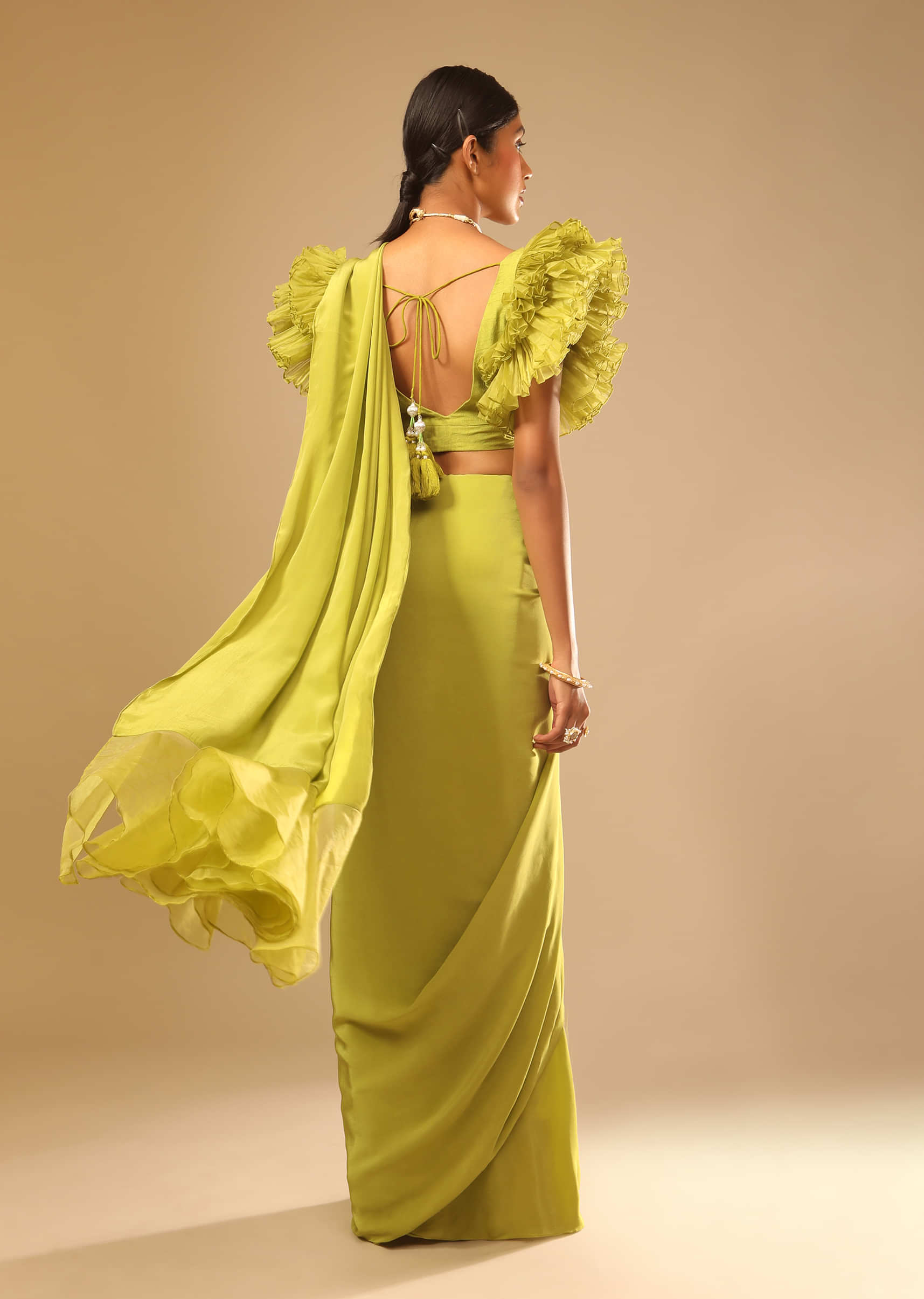 Lime Green Saree In Crepe With Elaborate Ruffle Sleeved Crop Top And Heavy Stone Embroidered Belt