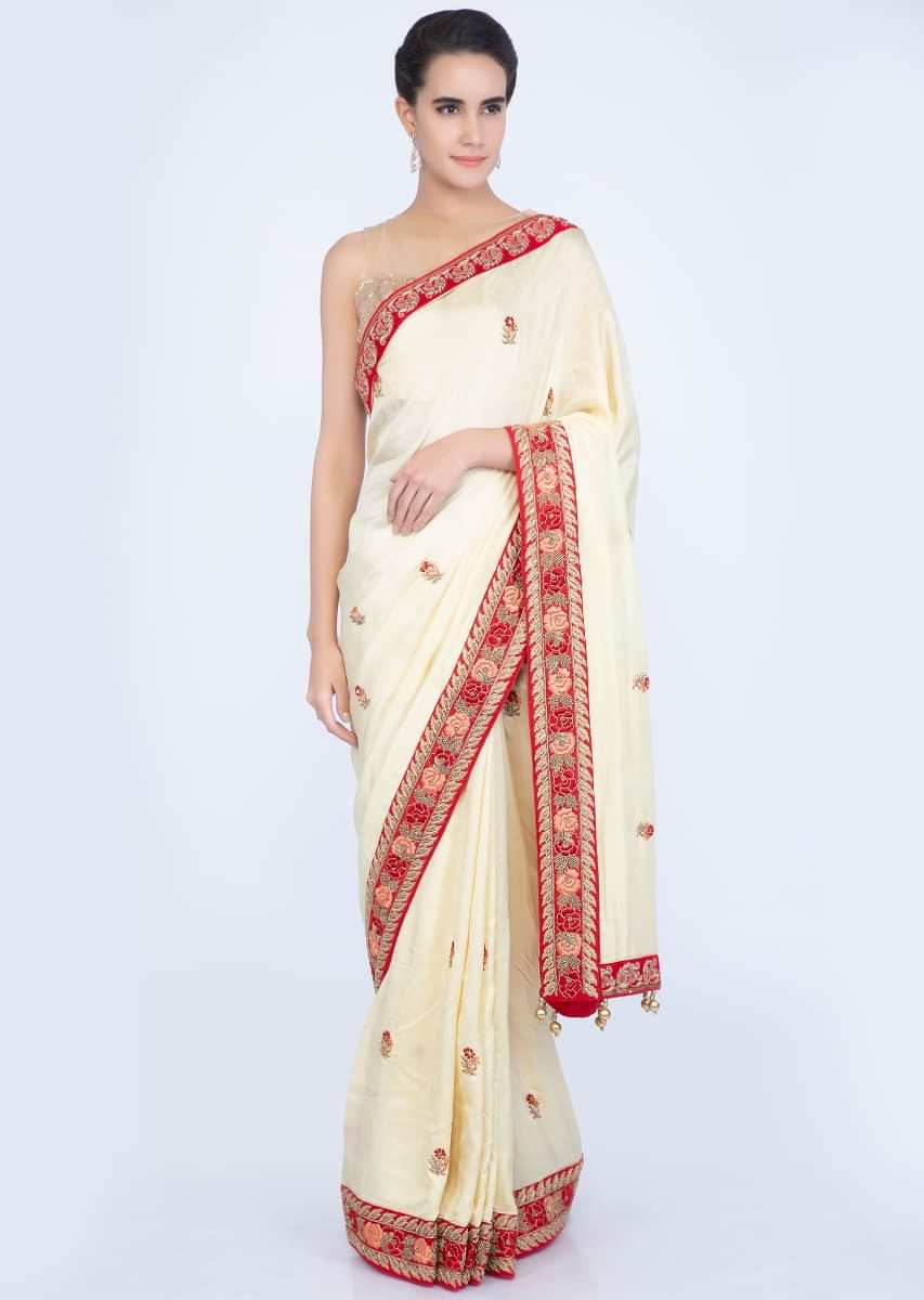 Lime yellow silk saree with floral embroidered butti and border only on Kalki