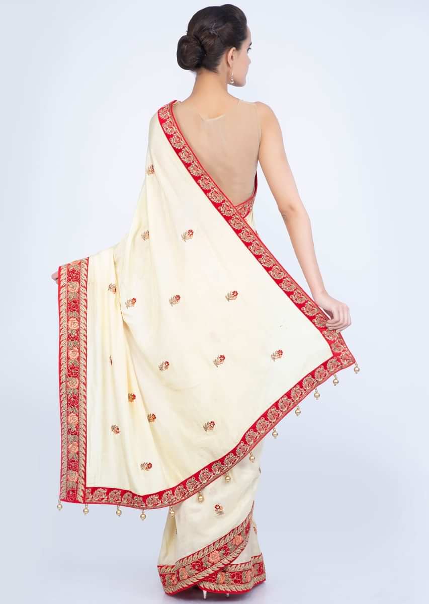 Lime yellow silk saree with floral embroidered butti and border only on Kalki
