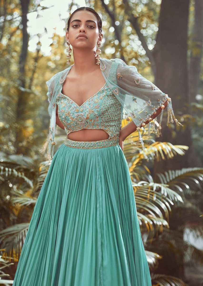 Pale Turquoise Gown With Front Cut Out On The Hand Embroidered Bodice And Topped With Matching Cape Jacket