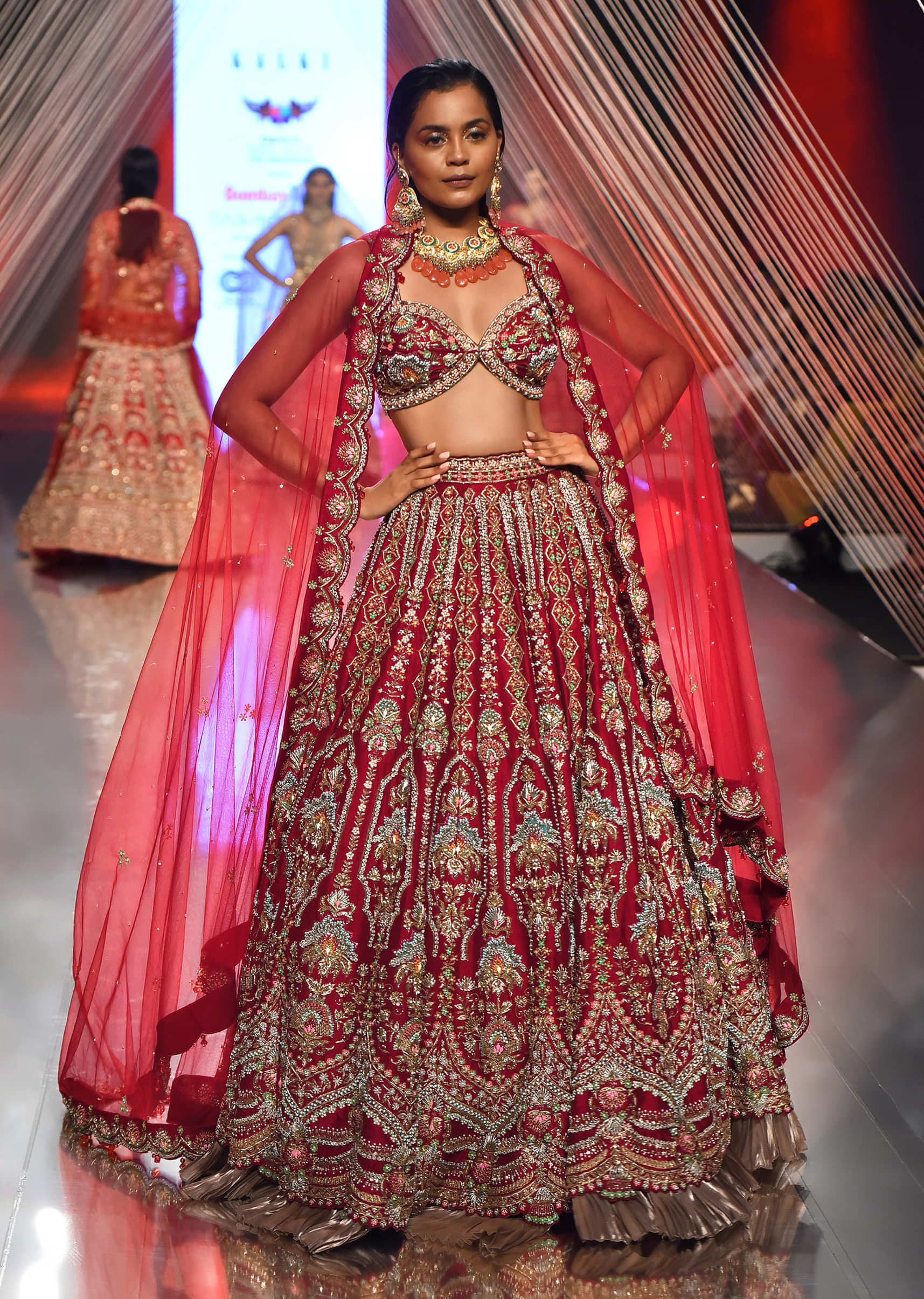 Red Lehenga And A Crop Top In Royal Heritage Embroidery, Bustier Comes In Sleeveless With Back Hooks Closure