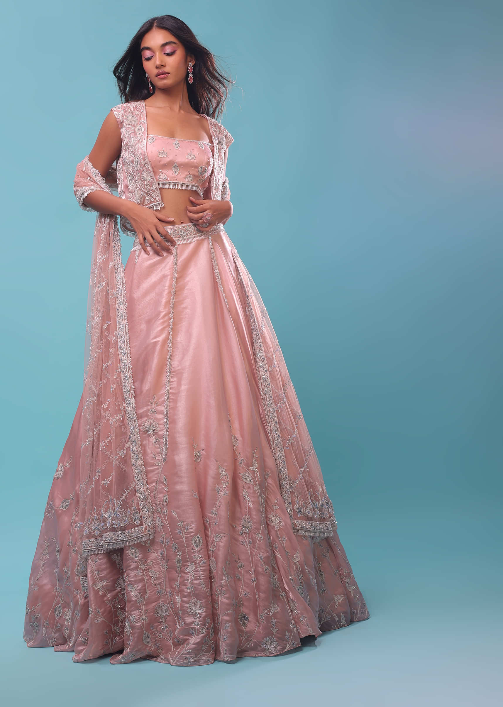 Powder Pink Lehenga And Crop Top In 3D Sequins Floral Motifs Embroidery, The Crop Comes In A Spaghetti Strap, Jacket In Sleeveless In Stones Emroidery