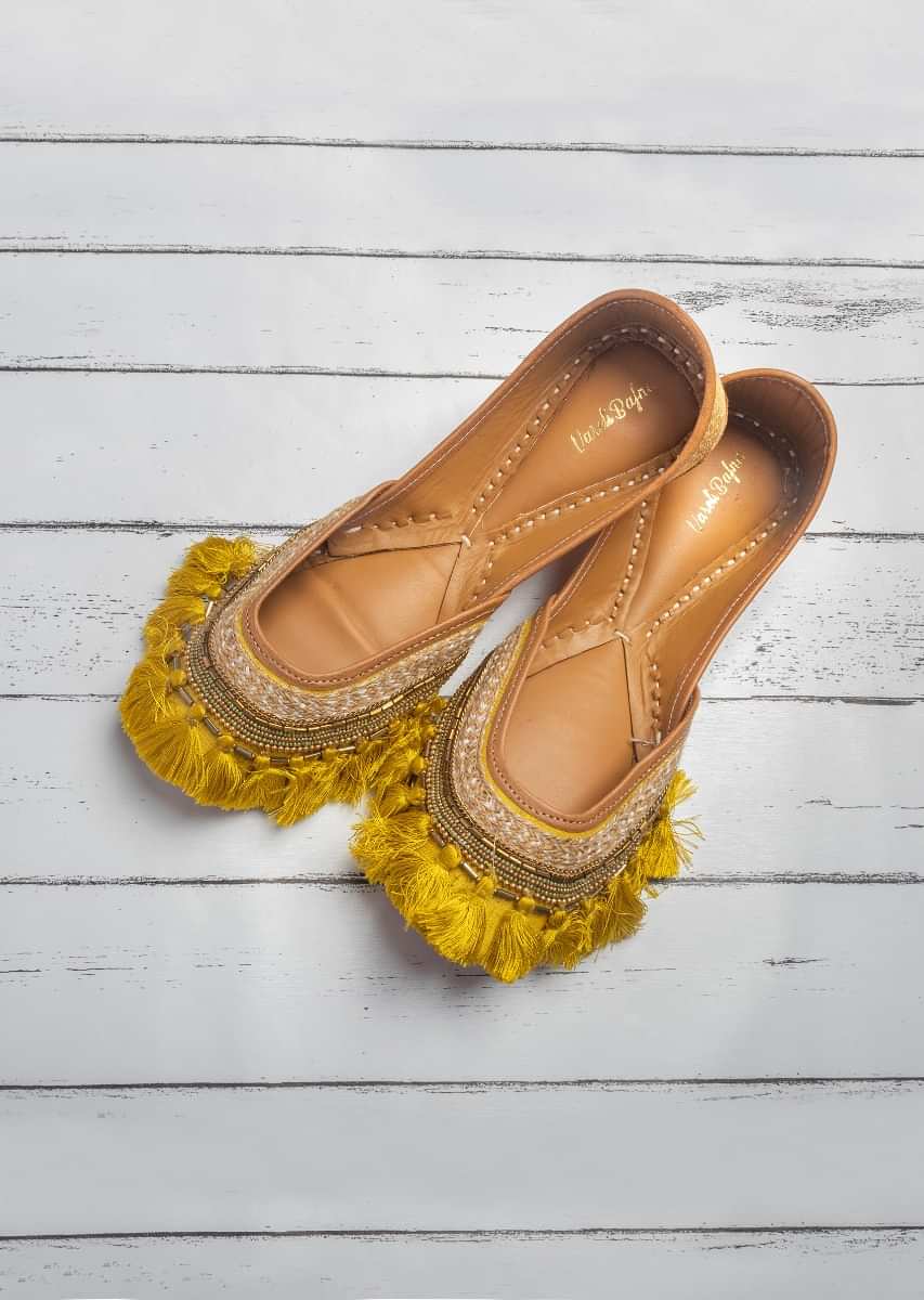 Mustard Juttis In Silk With Beads And Sequins Work Along With Tassels By Vareli Bafna