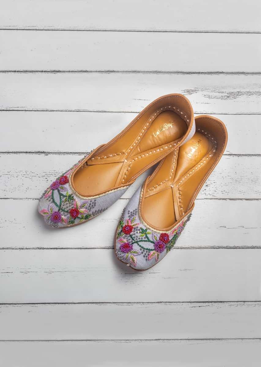 Purple Juttis In Linen With Multi Color Zardozi And French Knots Work In Floral Design By Vareli Bafna
