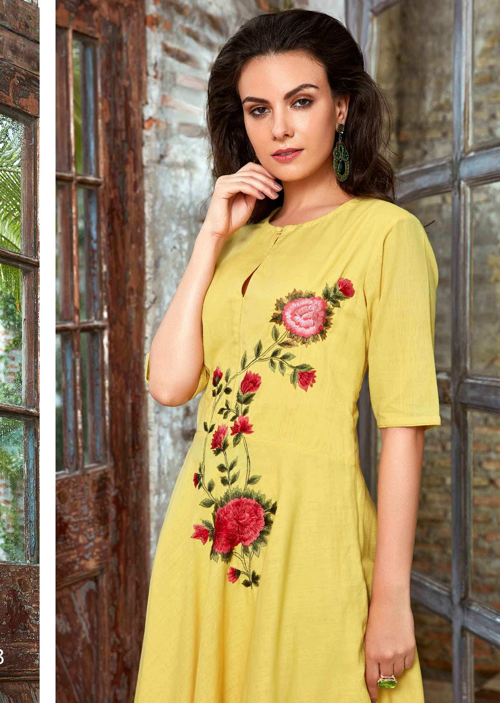Macaroon yellow cotton suit in floral resham embroidery on the center bodice and waist 