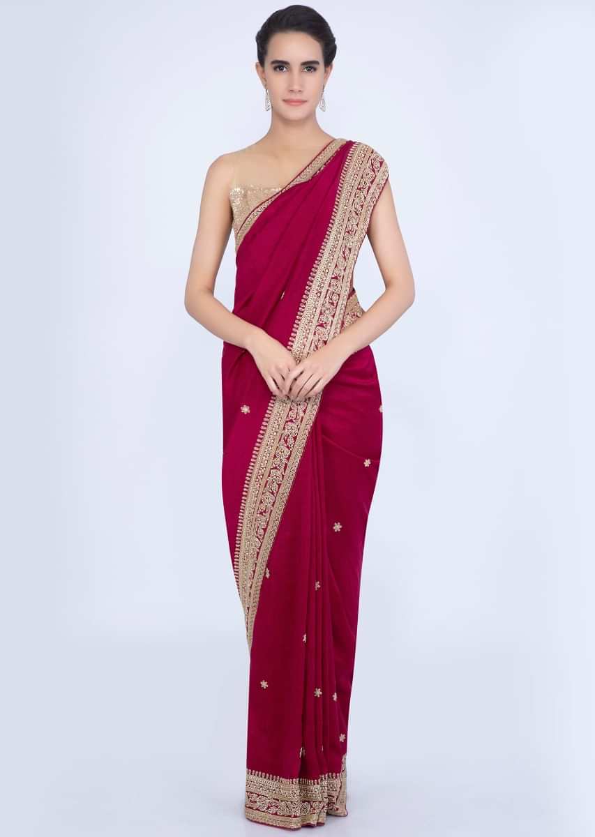 Magenta jute cotton saree with embroidered butti and border only on Kalki