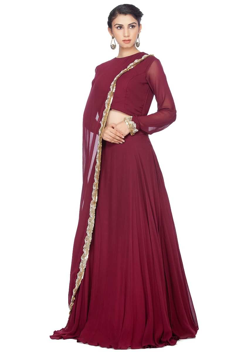 Magenta lehenga feautring in georgette with fancy attached cape in moti embroidered border