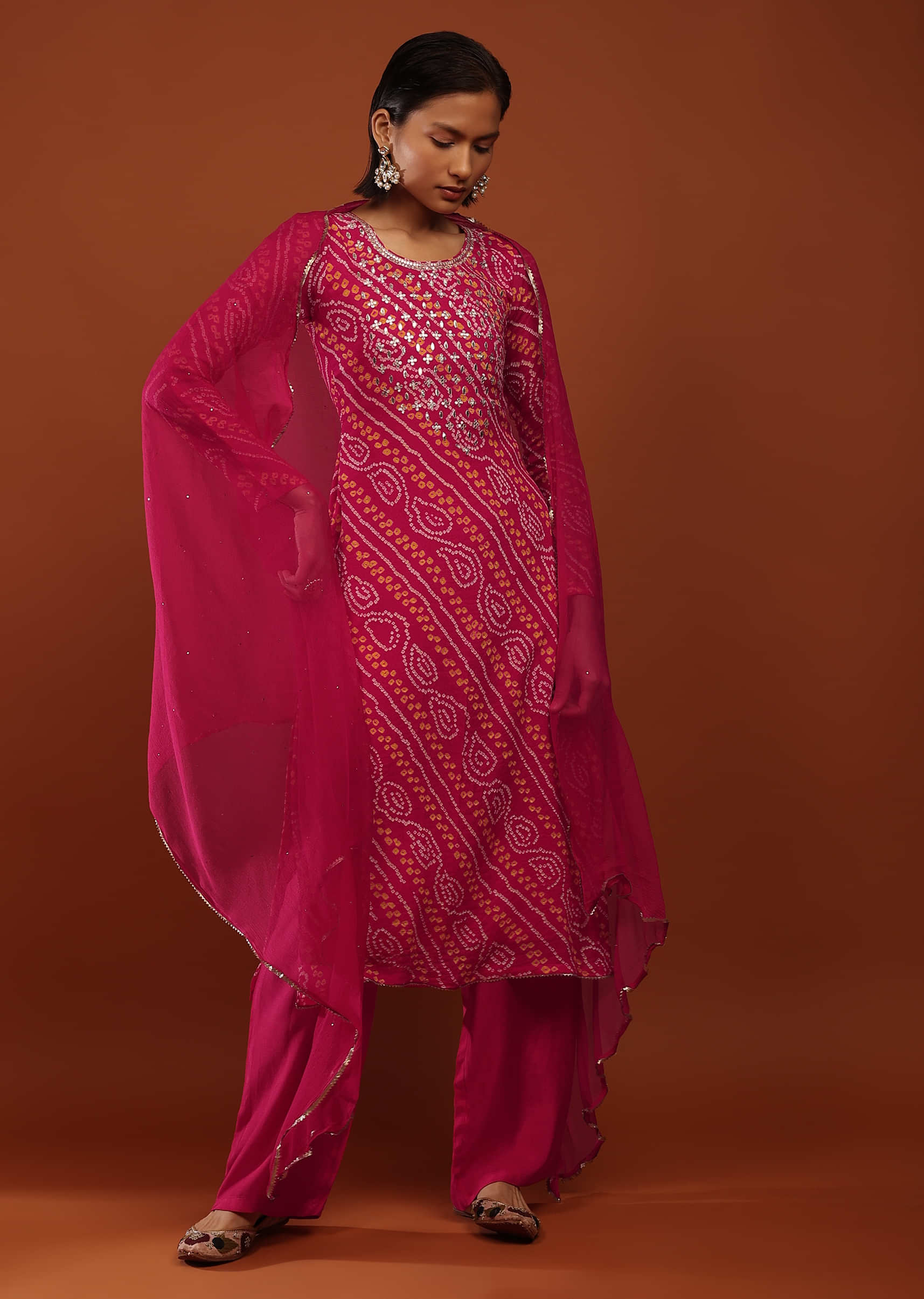 Magenta Straight Cut Suit In Georgette With Bandhani Print And Gotta Embroidered Yoke