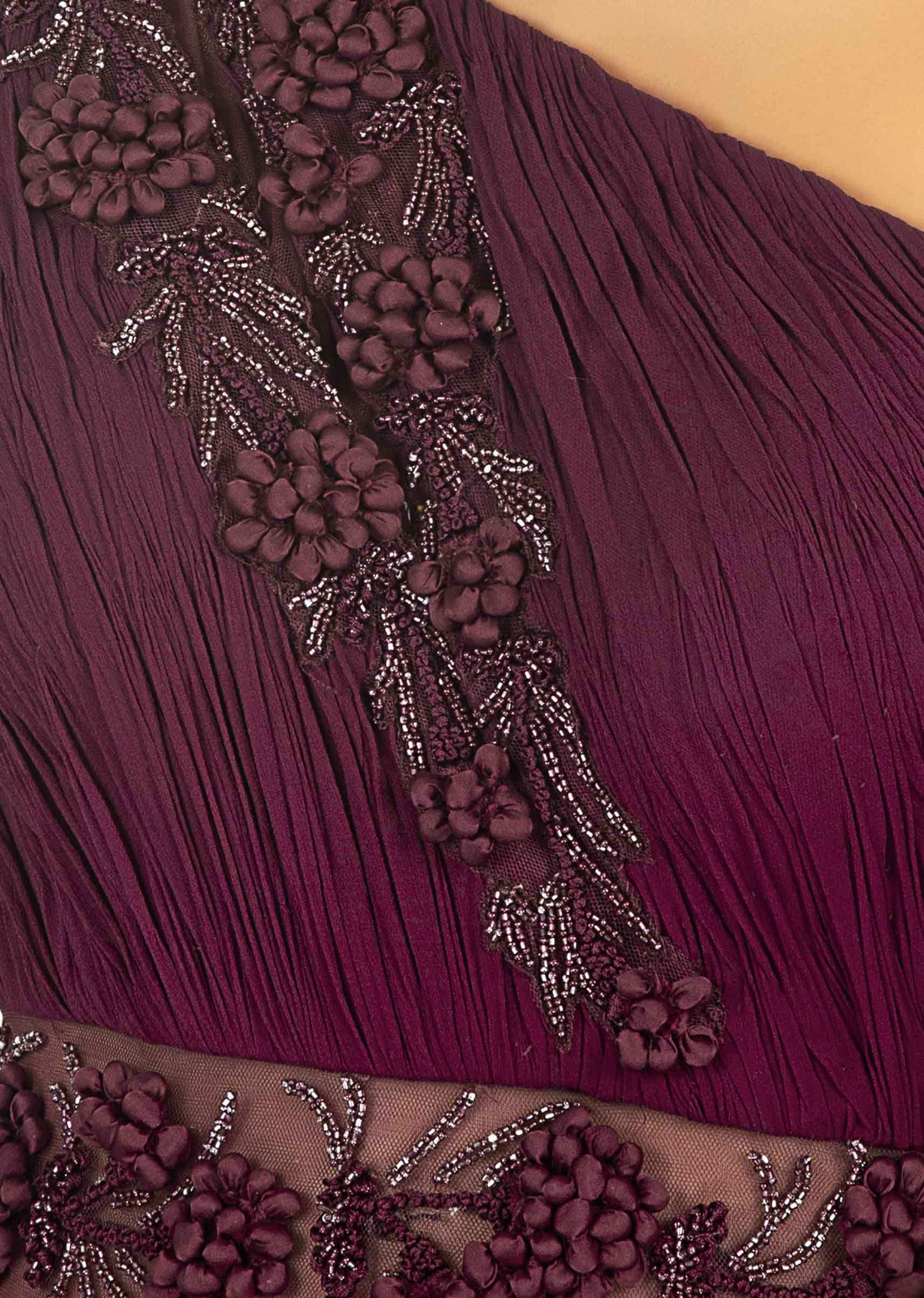 Maroon one shoulder satin gown with ruching bodice along with 3 D potli buttons