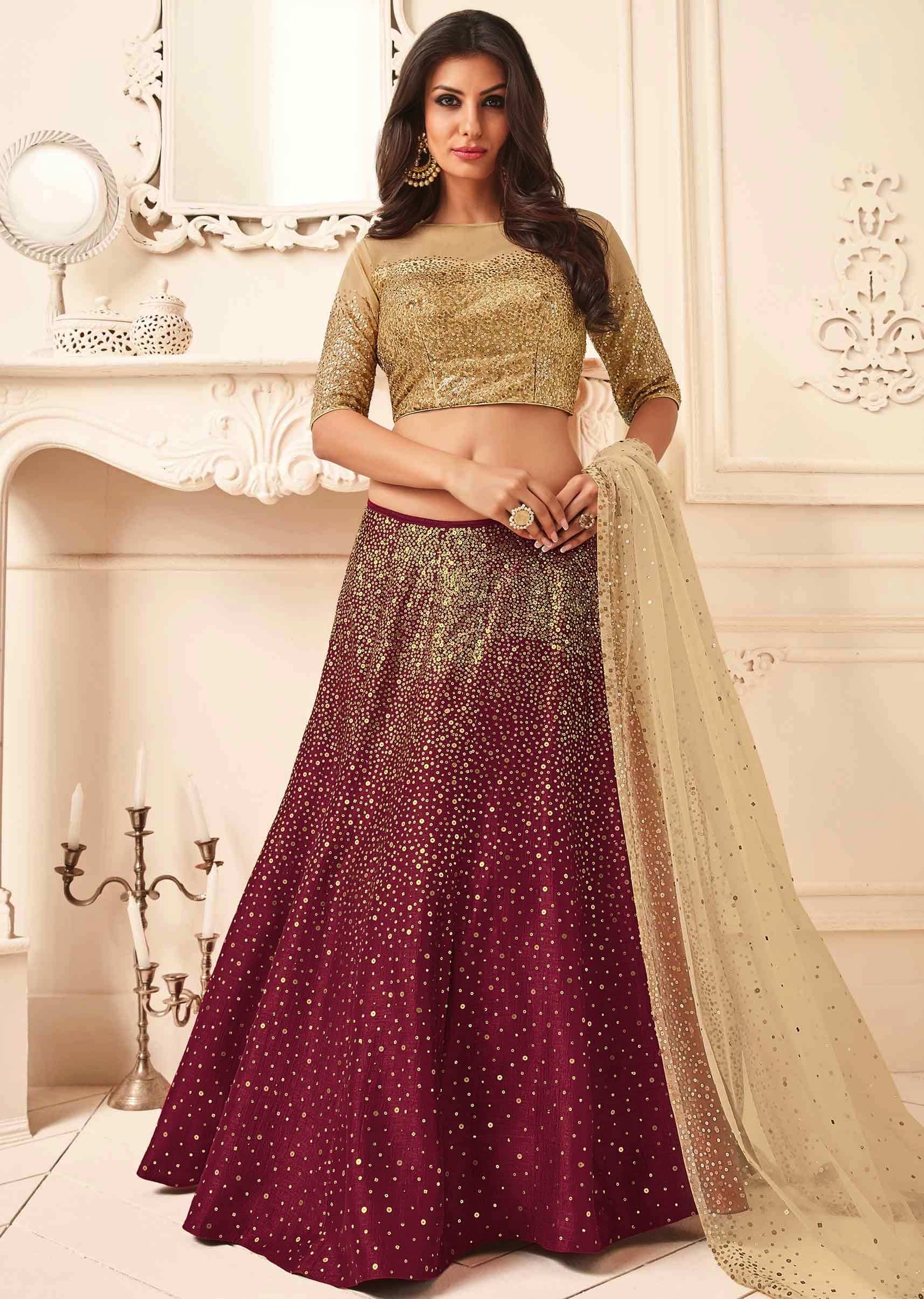 Maroon and beige lehenga in raw silk and net embellished in scatered sequin embroidery