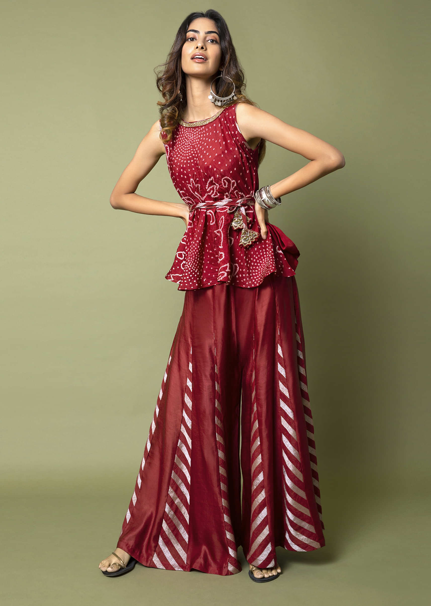 Maroon Flared Top With Bandhani And Antique Gold Hand Embroidery Paired With Zari Striped Paneled Sharara Pants  