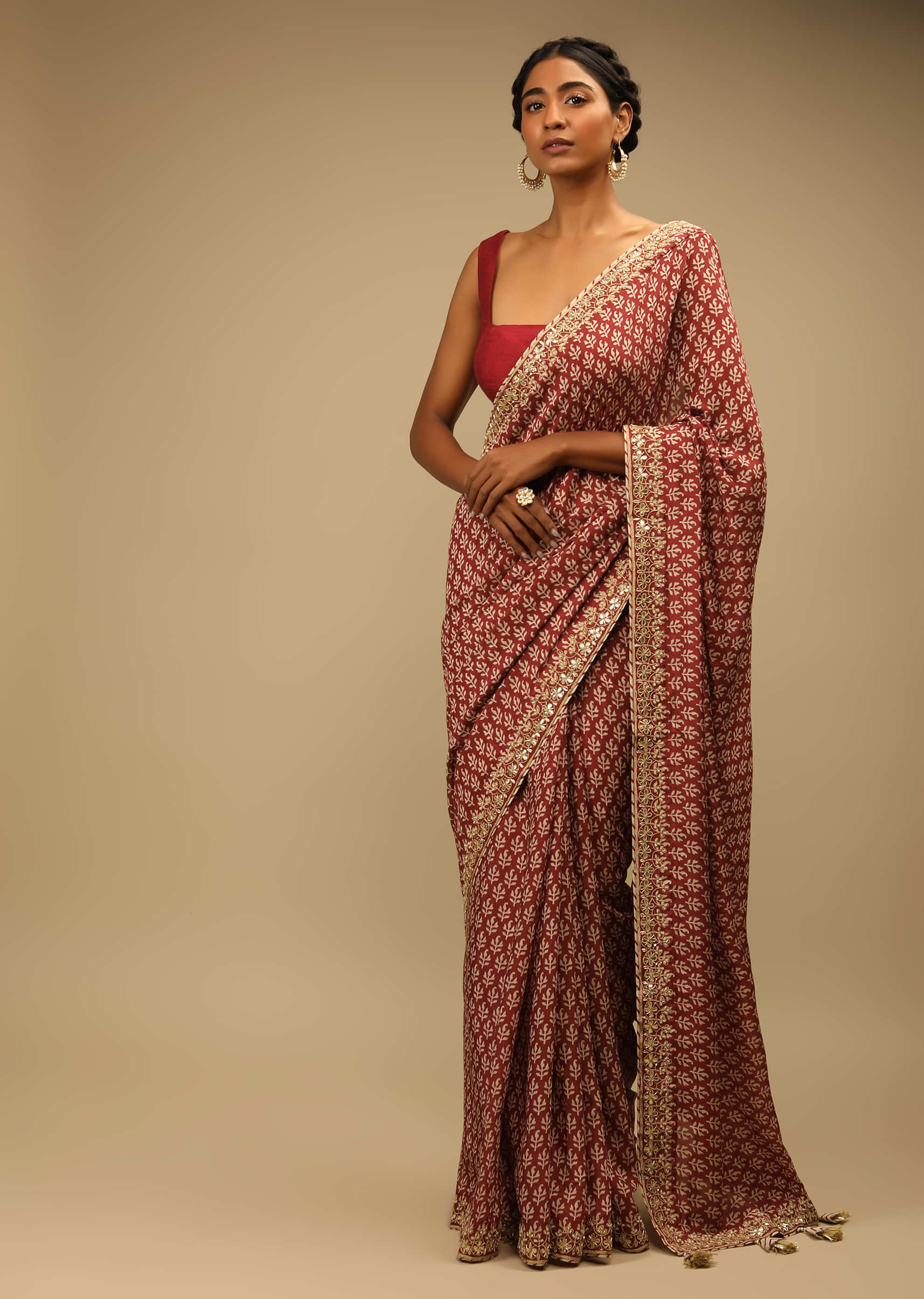 Maroon Saree In Soft Silk With Batik Buttis And Gotta Embroidered Border  