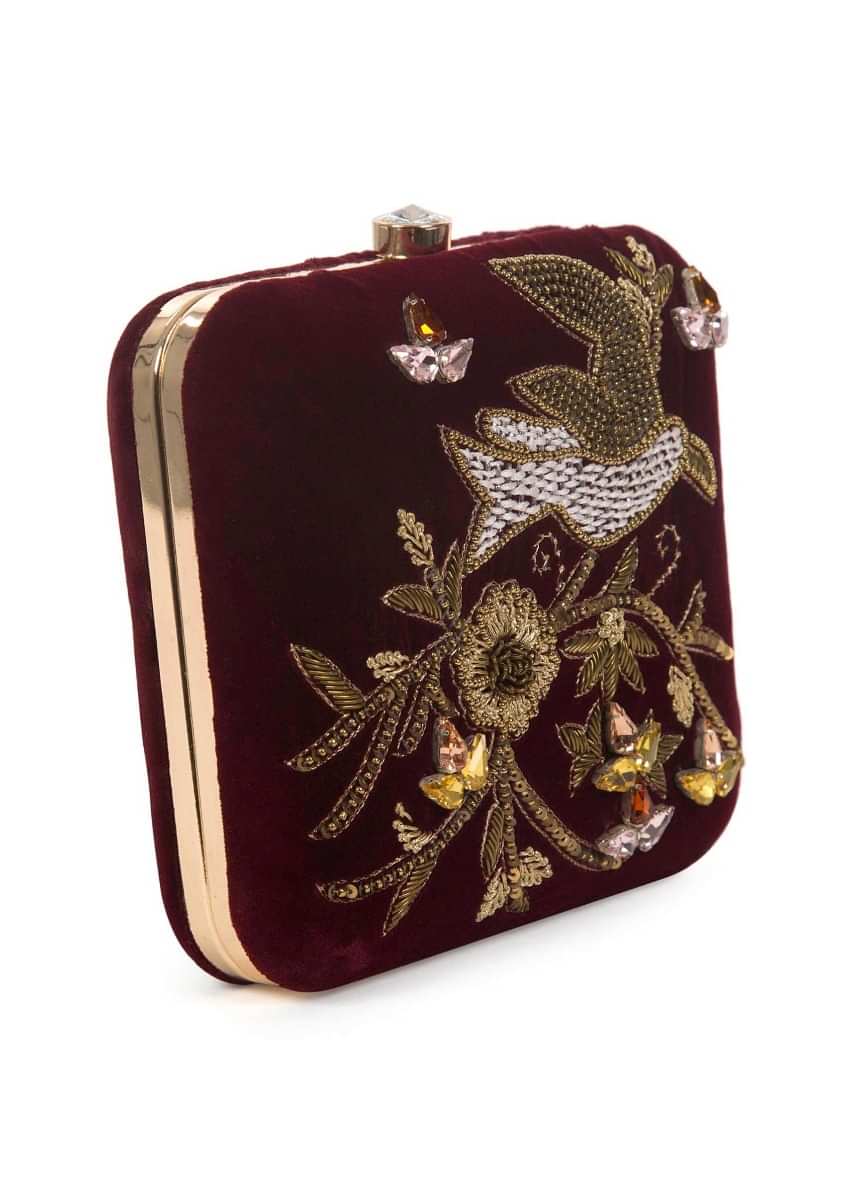 Maroon sequins and cutdana clutch in floral and bird motif