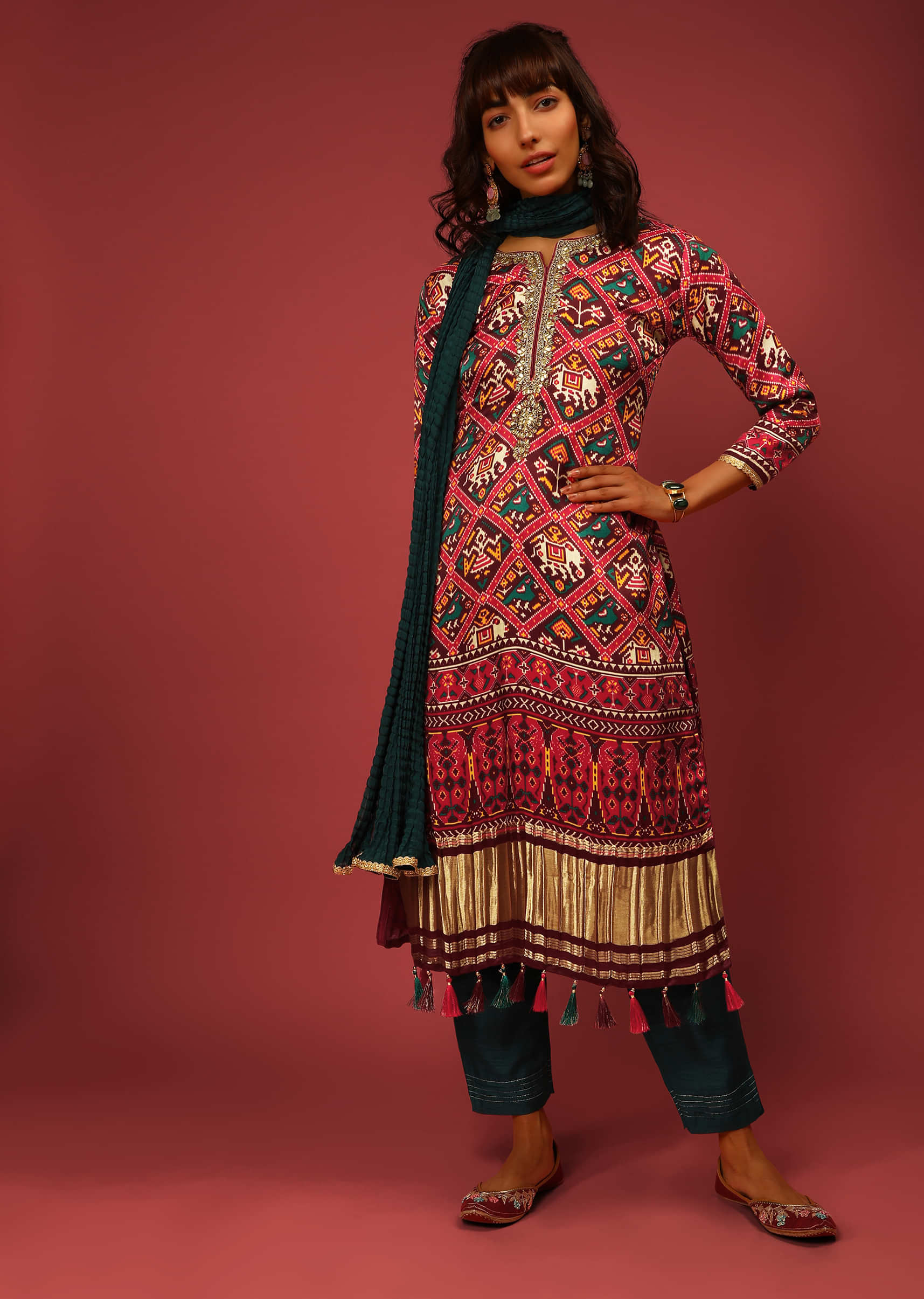 Maroon Straight Cut Suit In Satin Blend With Patola Print And Brocade Border Edged In Tassels  
