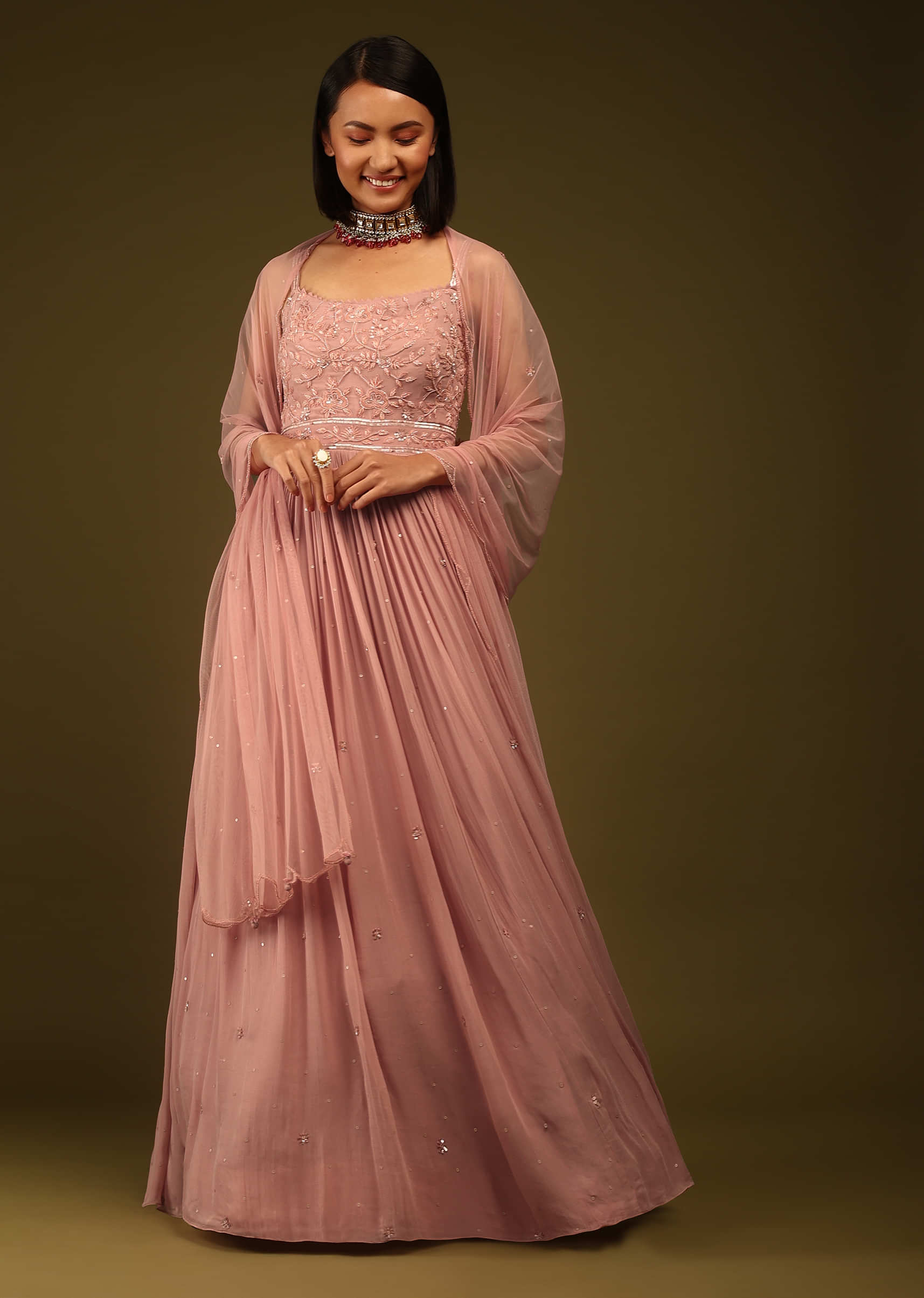 Mauve Glow Anarkali Suit Sequins And Cut Dana Embroidered Buttis All Over, Sleeveless, U Neckline Paired With The Matching Dupatta And Pants 