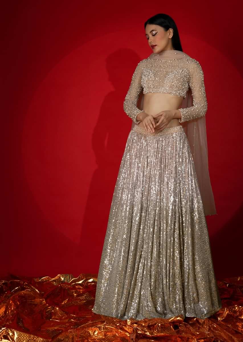 Melon Peach Ombre Lehenga Embellished In Sequins With Moti Embroidered Crop Top With Illusion Neckline And Full Sleeves