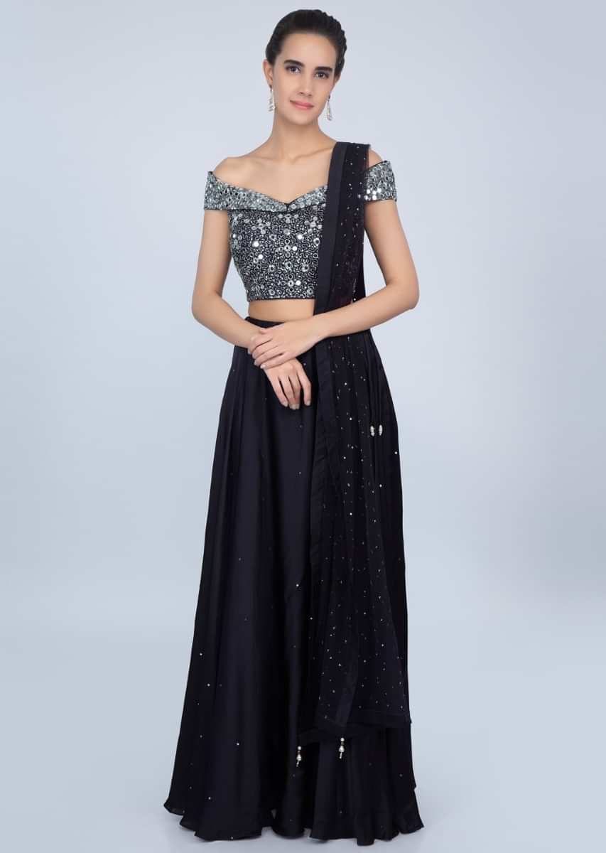 Mid night blue lehenga with embroidered off shoulder blouse and net dupatta  only on kalki
