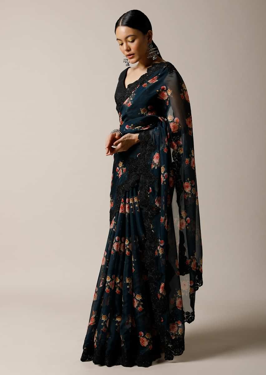 Midnight Teal Blue Saree In Organza With Floral Print And Black Scalloped Lace Along With Unstitched Blouse