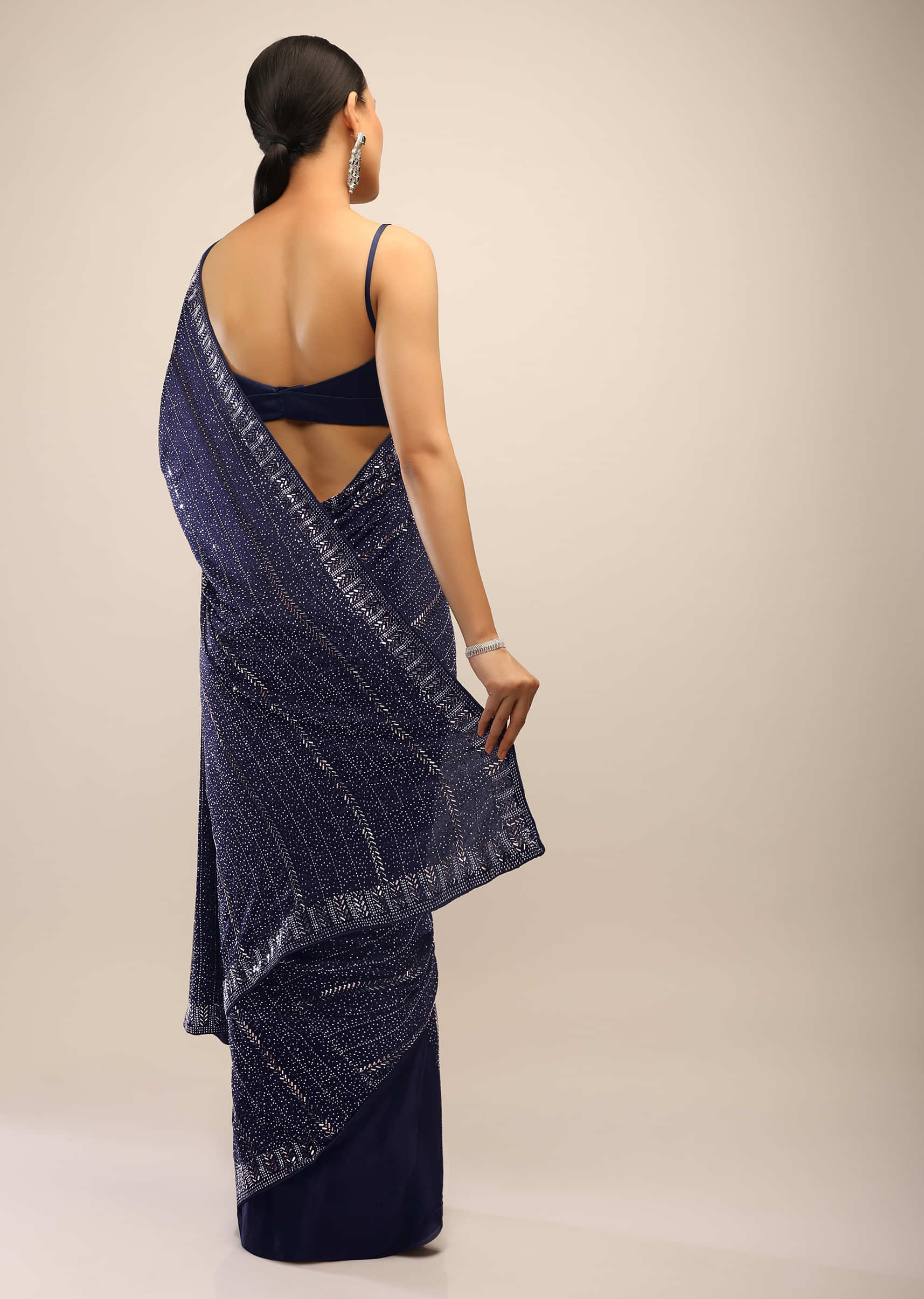 Midnight Blue Saree In Chiffon Satin Heavily Embellished With Kundan Work On The Pallu And Border