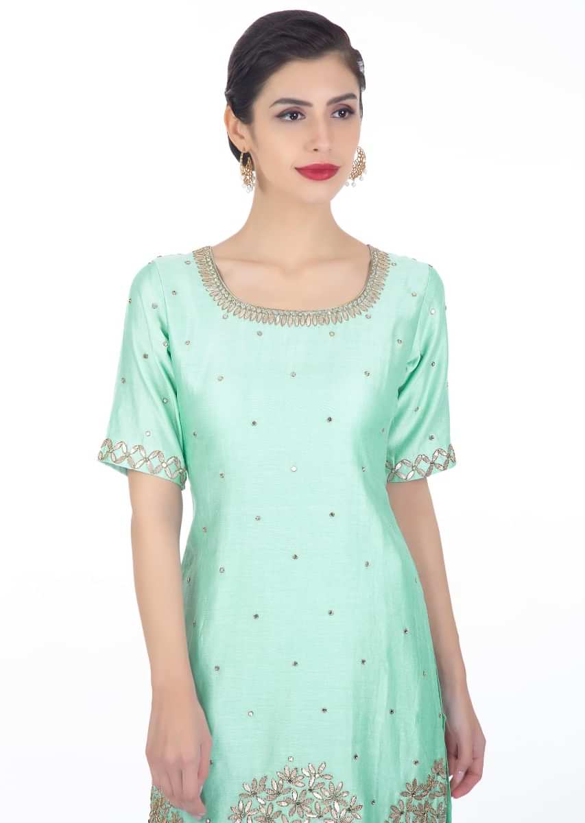 Mint blue embroidered silk sharara suit with yellow net dupatta