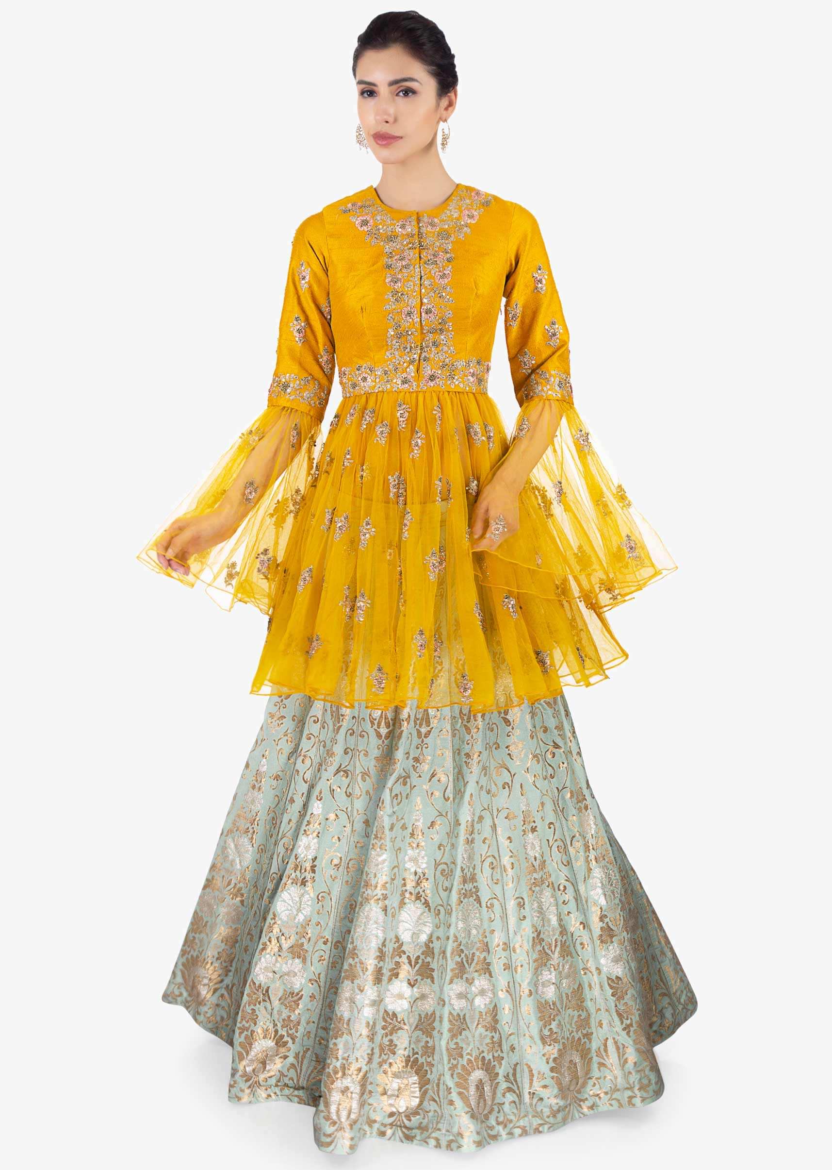 Mint green brocade  lehenga paired with  mustard thigh length long top 