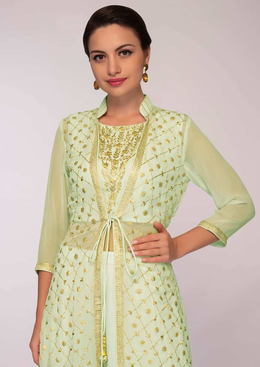 Mint green cotton skirt paired with embroidered long jacket and matching chiffon dupatta