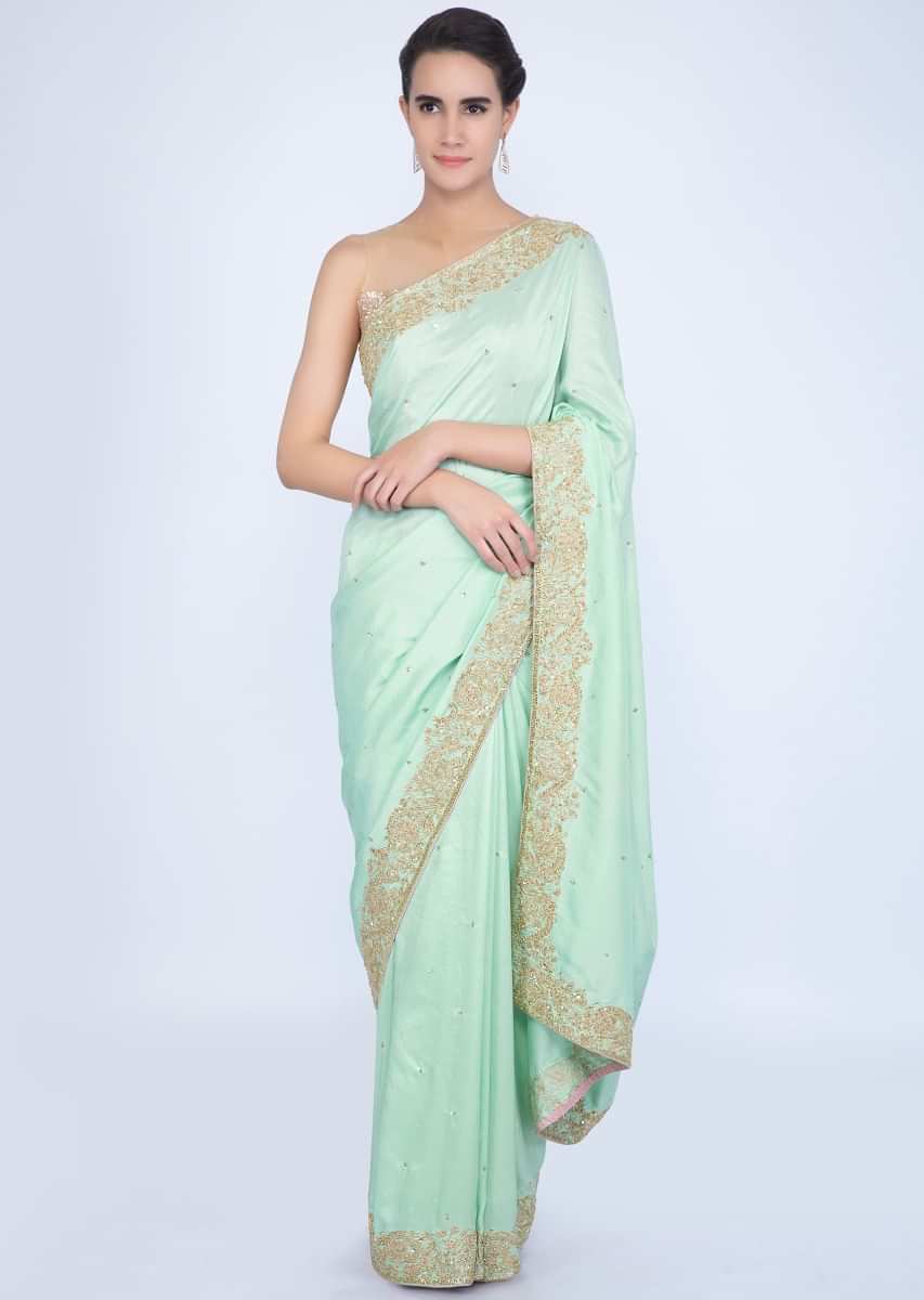 Mint green crepe silk saree with butti and border only on Kalki