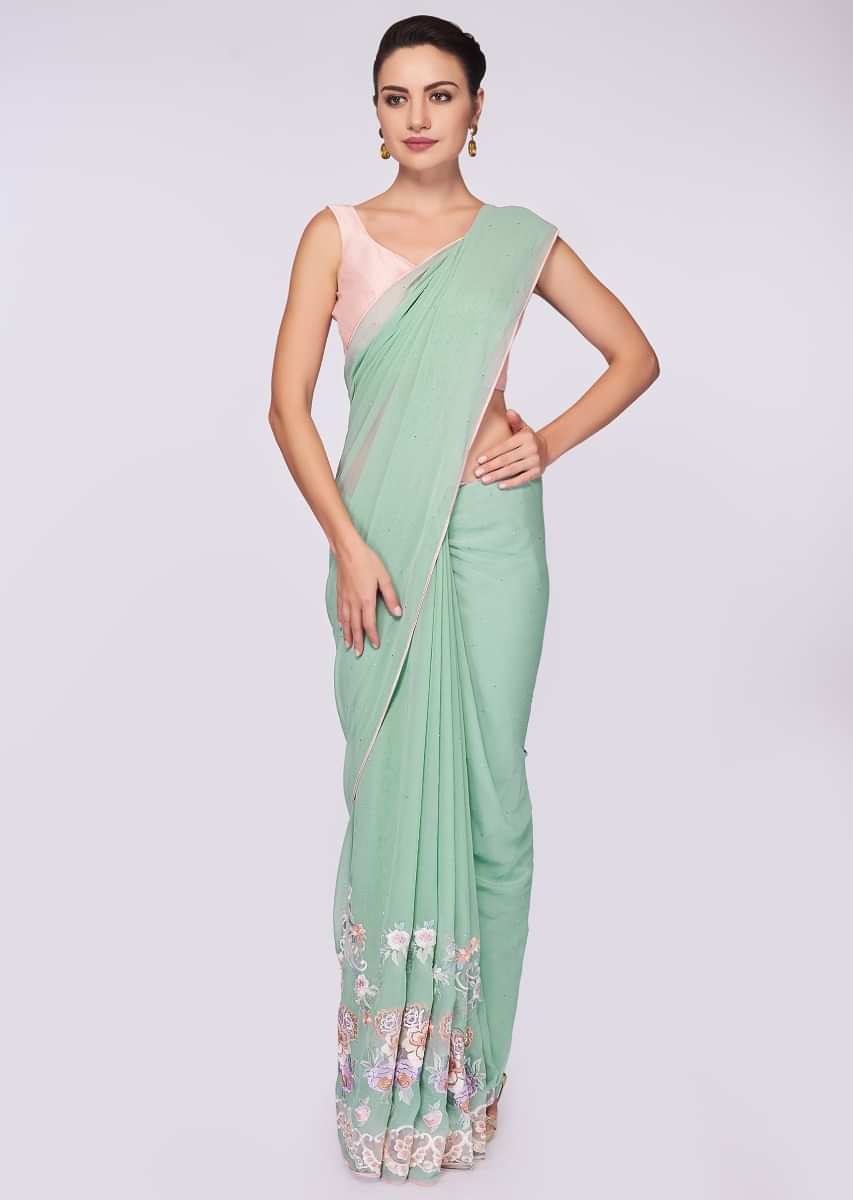 Mint green georgette saree having lower bottom in floral resham embroidery