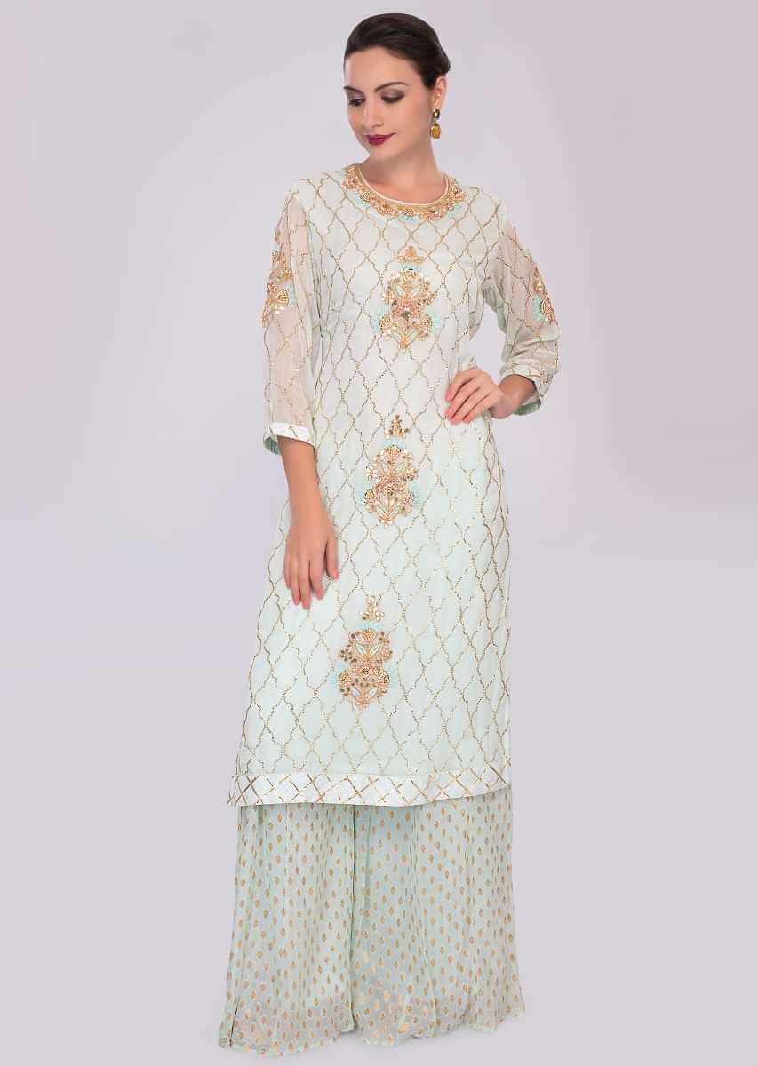 Mint green georgette suit in embroidery and butti paired with weaved palazzo
