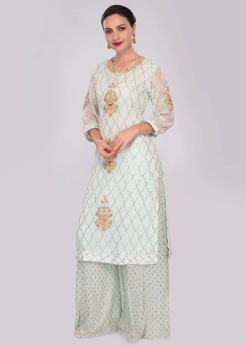 Mint green georgette suit in embroidery and butti paired with weaved palazzo