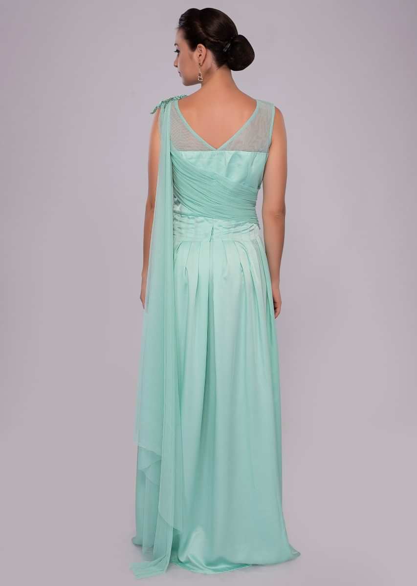 Mint green gown with floral embroidery and pleated bodice