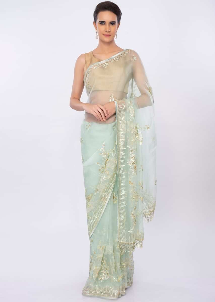 Mint green organza saree in floral embroidery and butti only on kalki