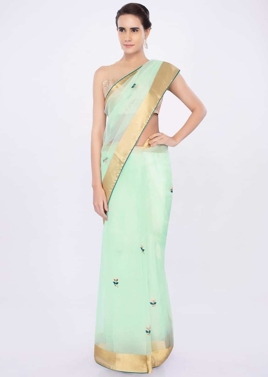 Mint green organza saree with floral butti only on kalki
