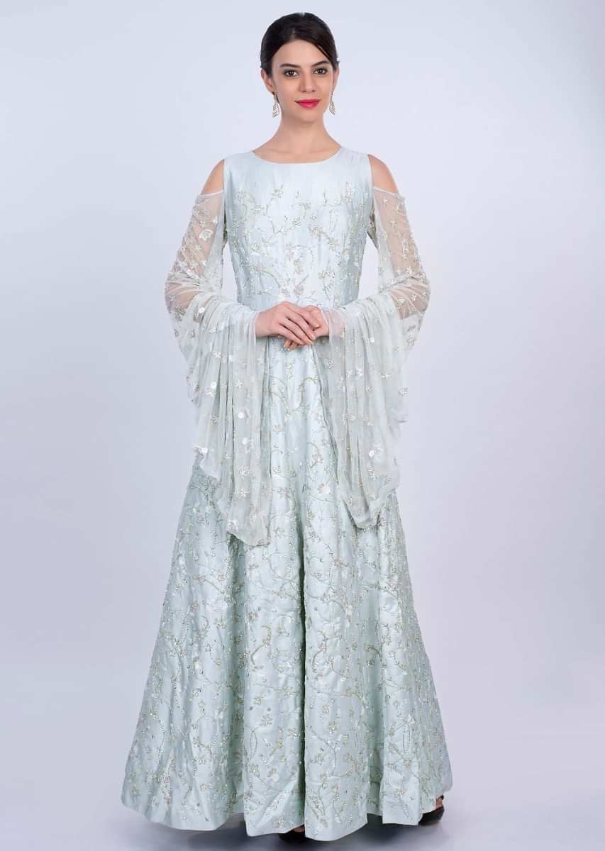Mint heavy flared gown with its fancy cold shoulder with extended net sleeves only on Kalki