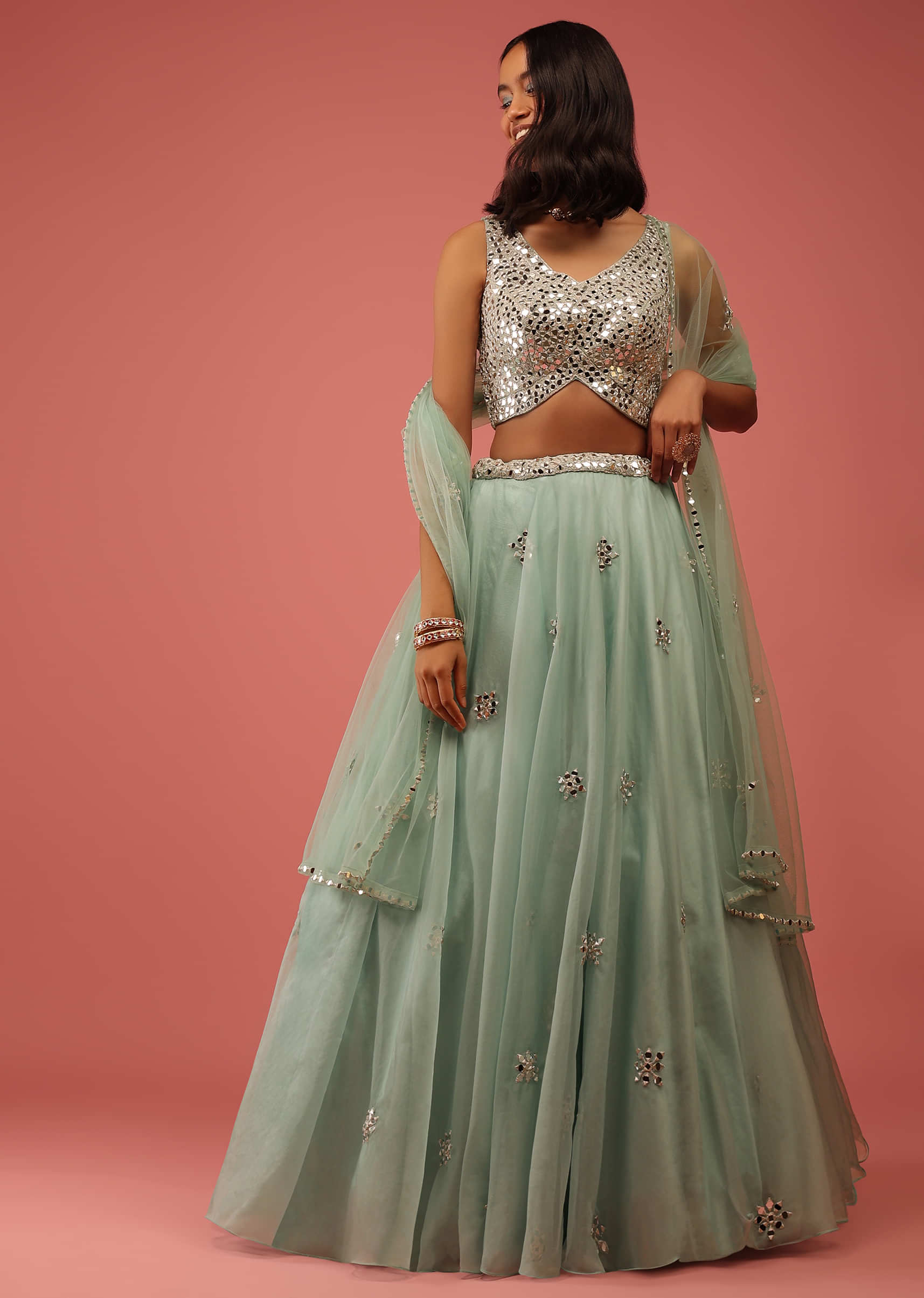 Mint Green Lehenga In Organza With A Heavily Embroidered Crop Top In Mirror Work