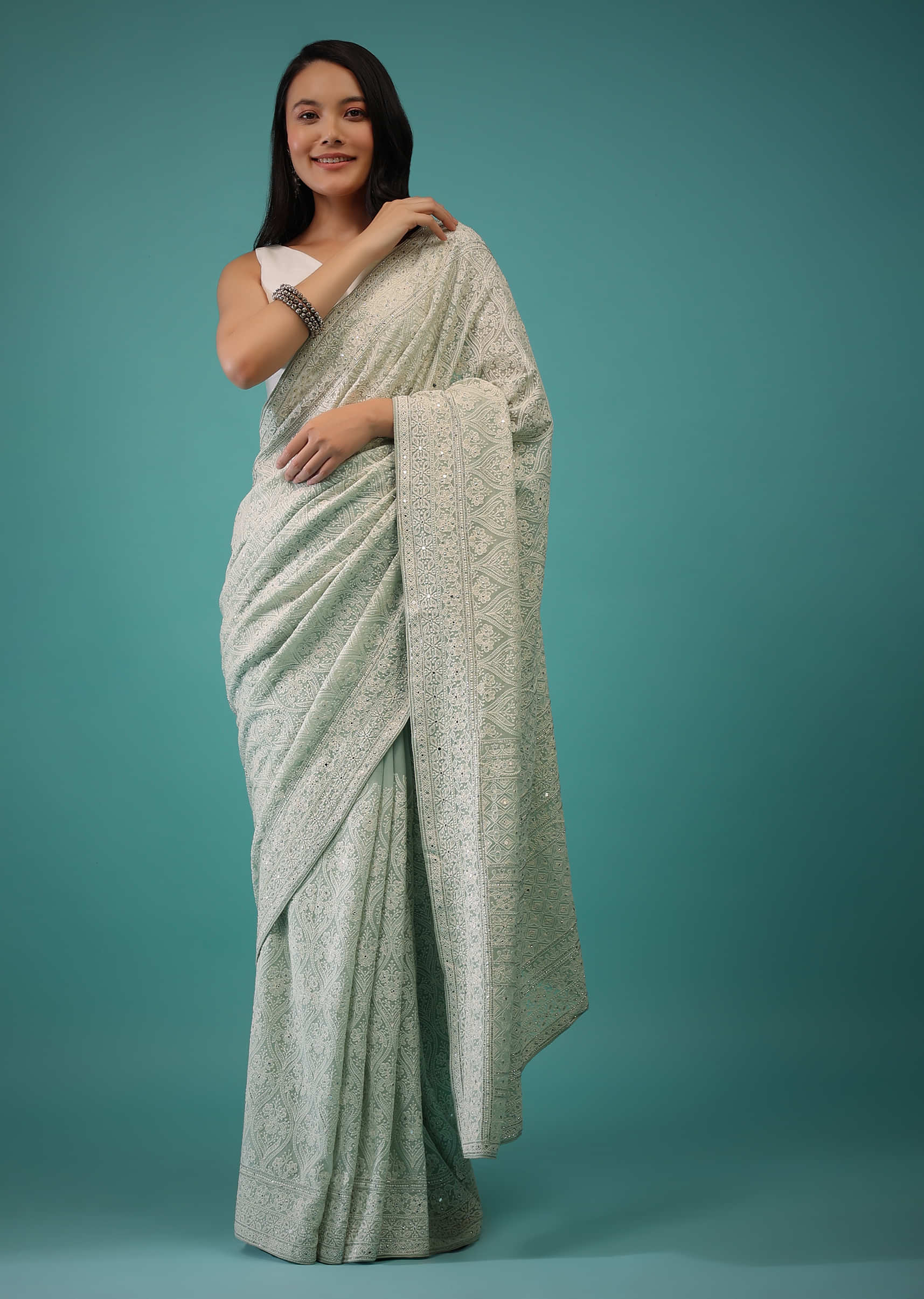Mist Green Georgette Saree In Lucknowi Threadwork In A Moroccan Jaal, It Has Mirror Embroidery Detailing On The Pallu
