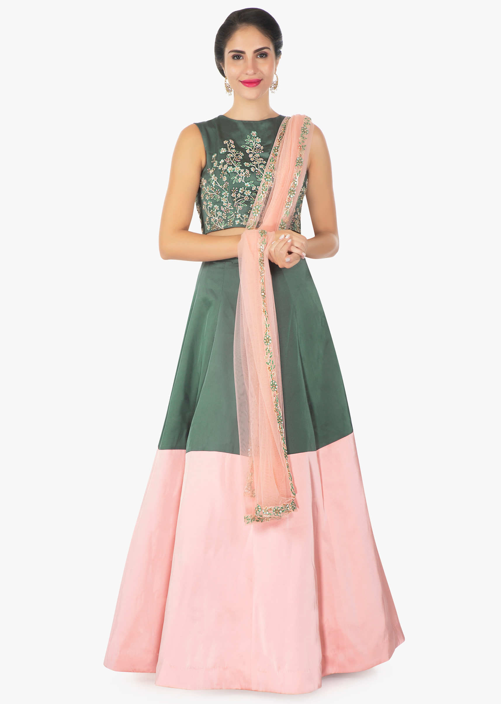 Moss green and pink satin lehenga with a matching crop top and pink net dupatta 
