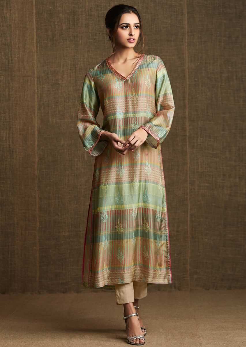 Multi color silk kurti in silk with floral print and embroidered piping