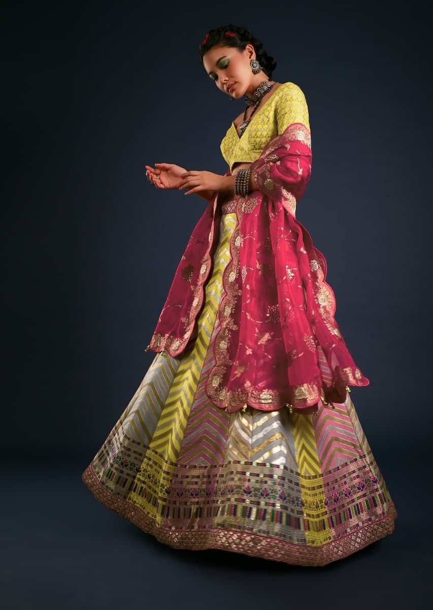 Multi Colored Panel Lehenga With Chevron Brocade Design And Contrasting Unstitched Blouse And Dupatta 