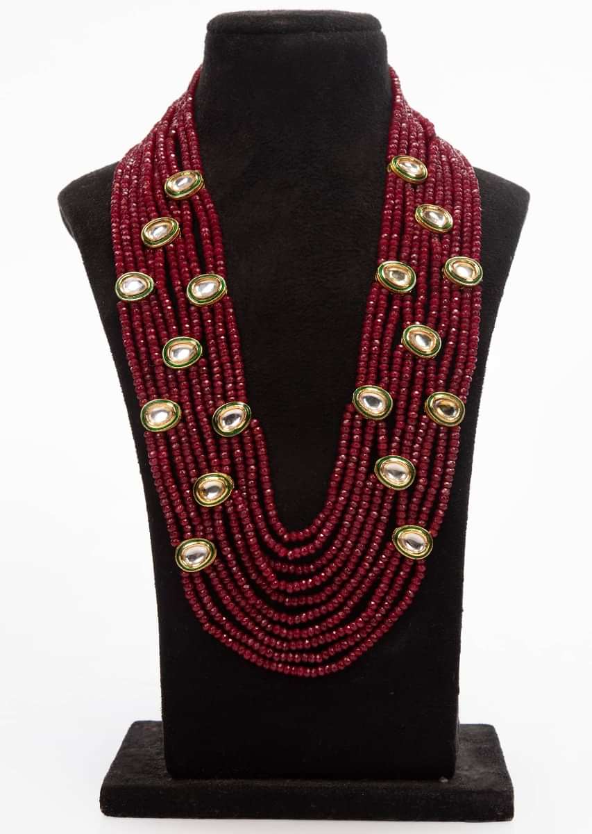 Multi string layer magenta bead necklace with kundan highlight only on Kalki