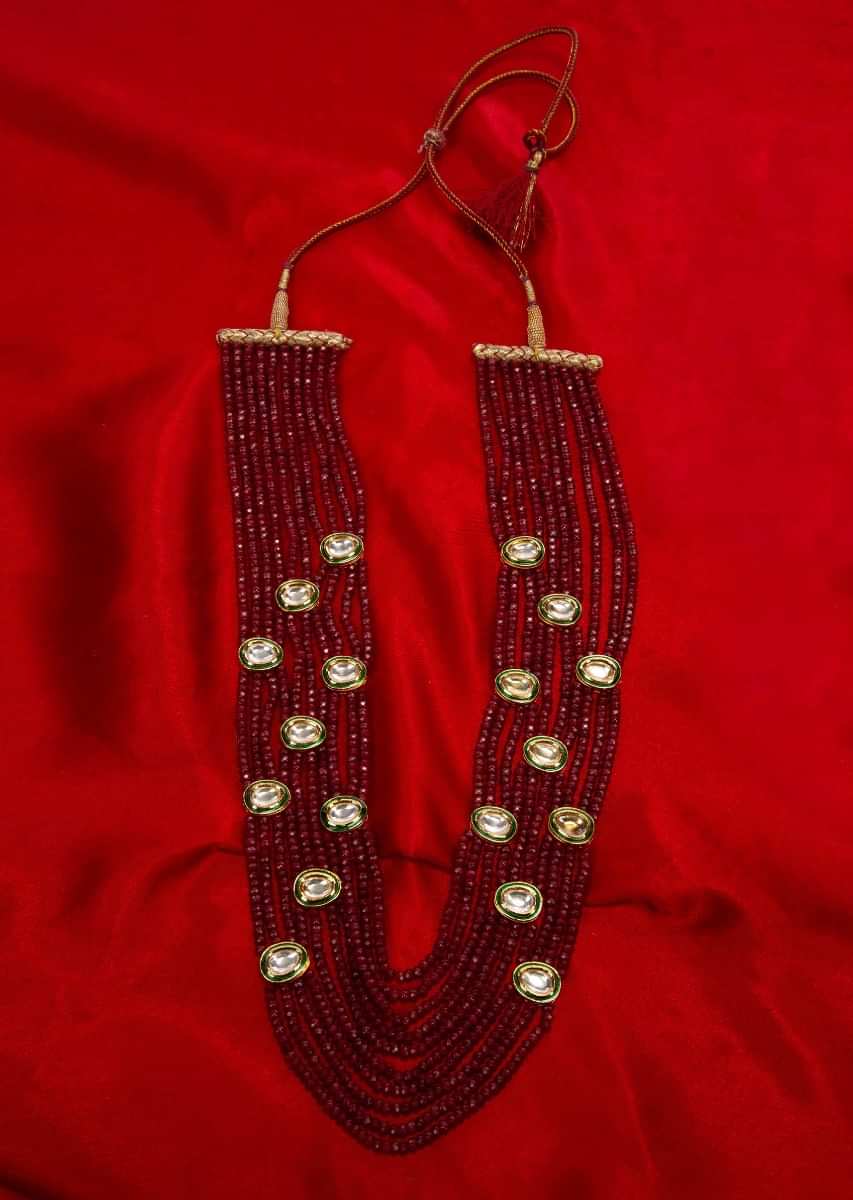 Multi string layer magenta bead necklace with kundan highlight only on Kalki