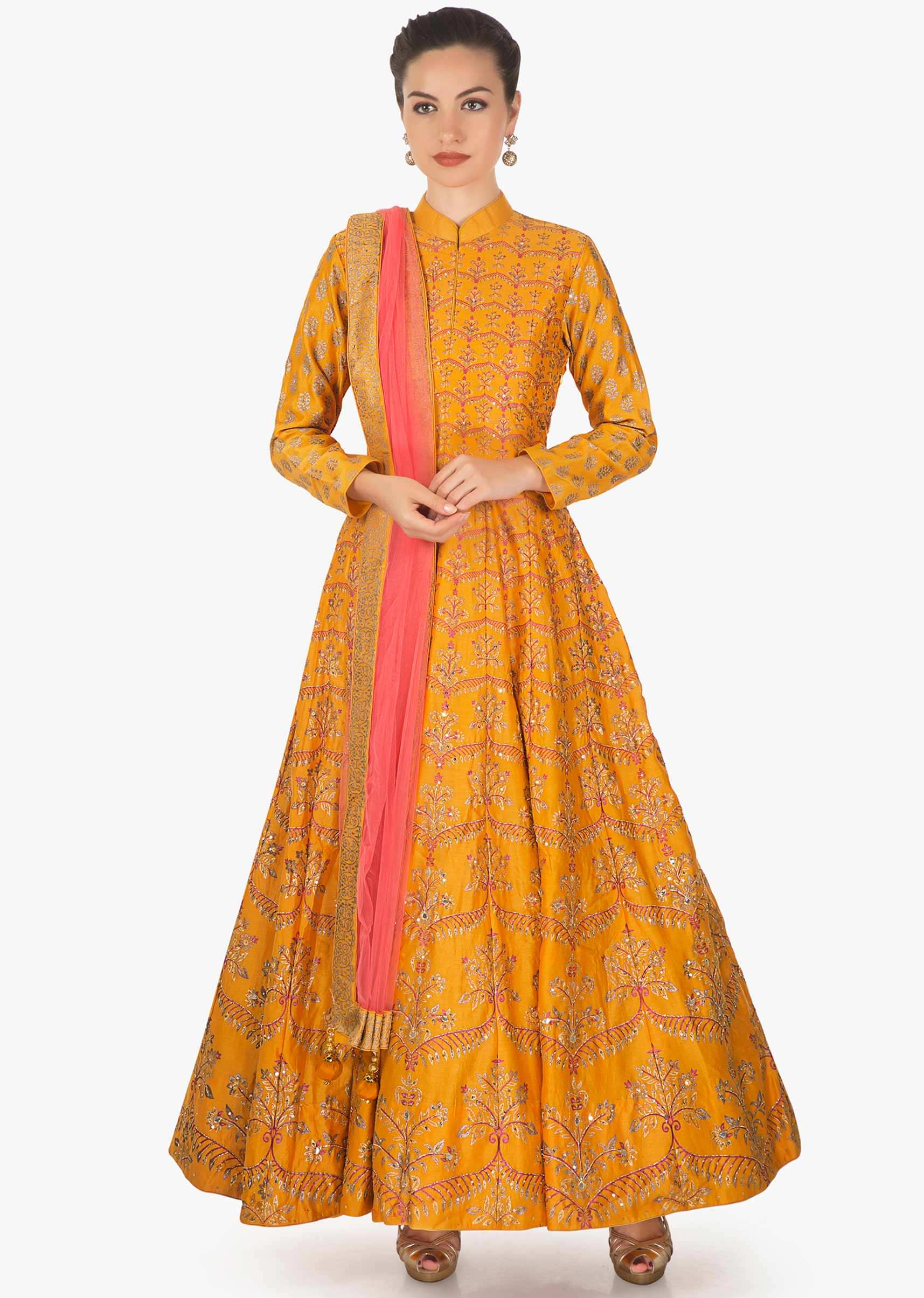 Mustard Pink cotton silk anarkali paired with a Pink net dupatta and lycra chudidar only on kalki