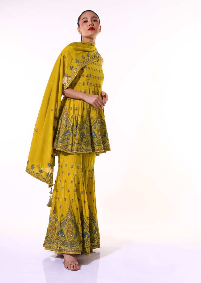 Mustard Sharara Suit With Peplum Kurti Adorned With Colorful Resham Embroidered Geometric Motifs And Butti Design  